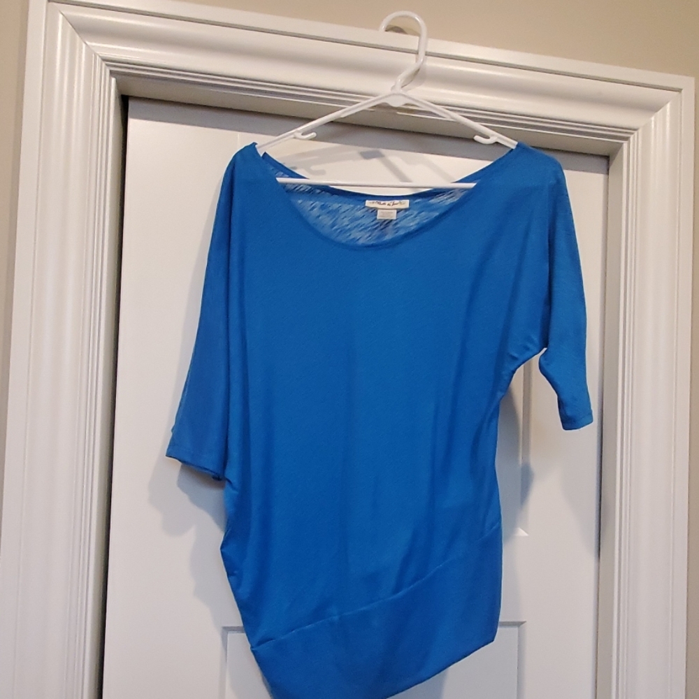 Great blue asymmetrical shirt.